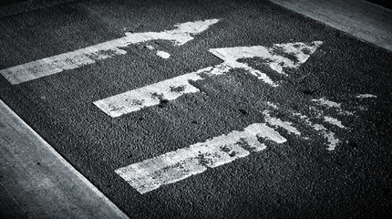 Pedestrian crossing with arrows on asphalt