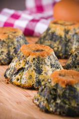Spinach cakes on wooden cutting board.