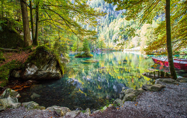Red Boats By The Lake