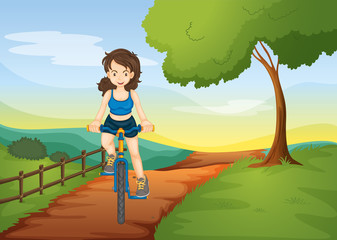 a girl riding on a bicycle