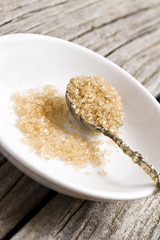 a Sugar spoon with brown sugar