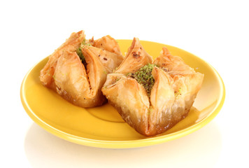Sweet baklava on plate isolated on white