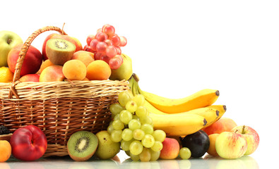 Assortment of exotic fruits in basket isolated on white