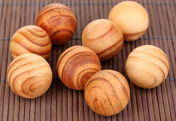 Wooden balls on bamboo mat