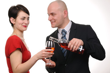 Young couple drinking red wine isolated on white background.