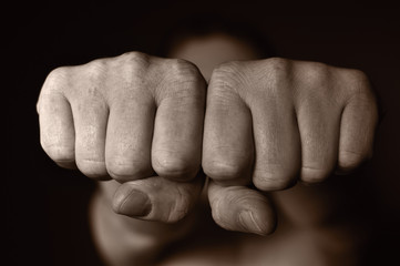 Two human fists as a symbol of aggression.