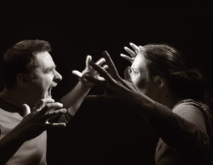 Man and woman screaming at each other. Marriage before divorce.