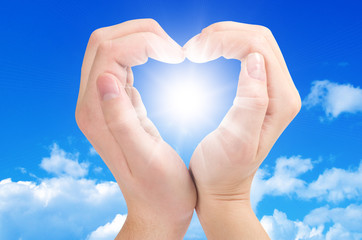 Two hands form a heart shape