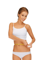 Obraz premium woman measuring her waist