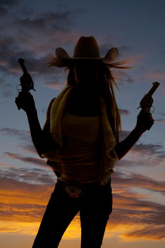 woman silhouette two guns