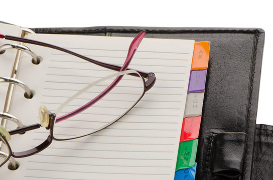 Leather notebook and glasses