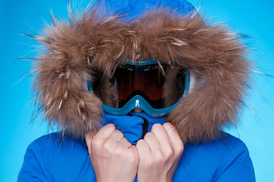 Skier In Winter Coat And Mask Feeling Cold