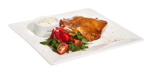 roasted chicken with vegetables on a white plate