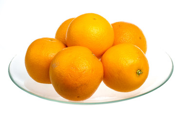 Heap of oranges in the dish