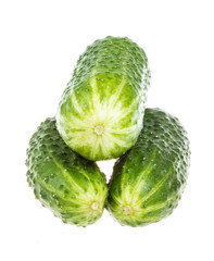 Healthy food. The green cucumbers isolated on white background