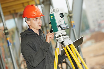 surveyor works with theodolite