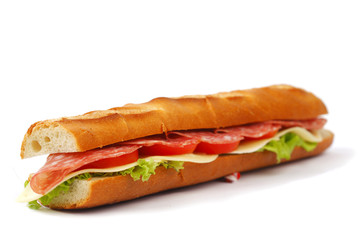 Long sandwich with  salami tomatoes isolated on white