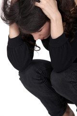 Sad woman squatting