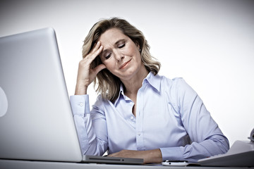 Business woman having a headache.