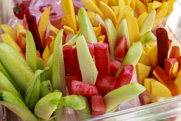Sliced fruits on a cup