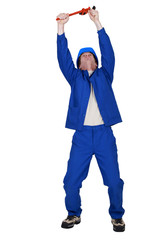 Plumber gesturing on white background