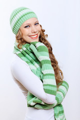 Young woman wearing winter hat and warm scarf