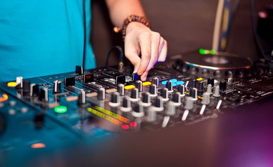 Dj mixing in night club