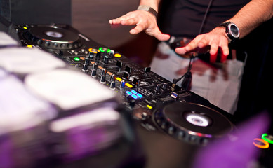 Dj mixing in night club
