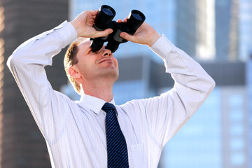 Businessman with binoculars