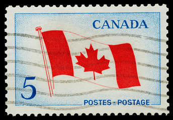 Mail stamp featuring the Canadian national flag, circa 1965
