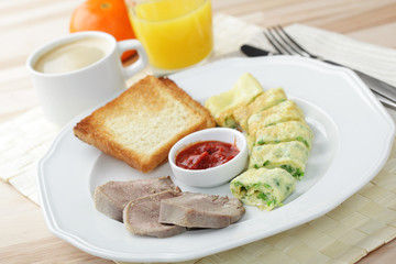 Breakfast with omelet and veal tongue