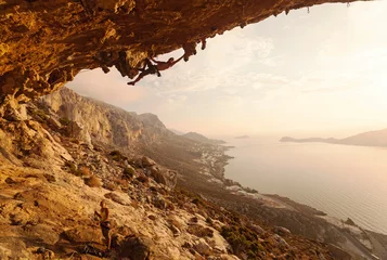 Plexiglas foto achterwand Rock climber at sunset, Kalymnos Island, Greece © Andrey Bandurenko