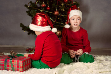 Two brothers in Santa hats, Christmas