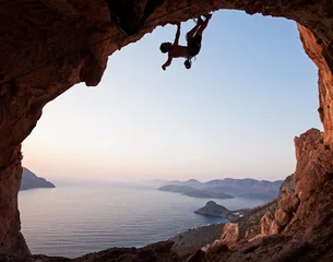 Gordijnen Silhouette of a rock climber at sunset, Kalymnos Island, Greece © Andrey Bandurenko