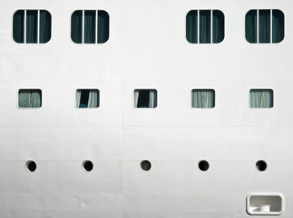Background texture photo of white ships hull with windows © evannovostro