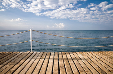 Obraz premium Wooden pier with railings. Mediterranean sea, Alanya, Turkey