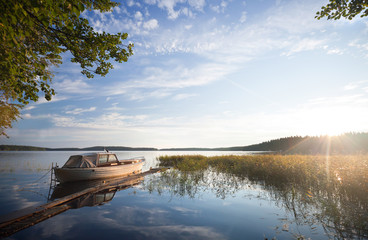 Small fishing boat moored on Saimaa lake, Finland