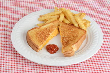 Top view grilled cheese sandwich with fries