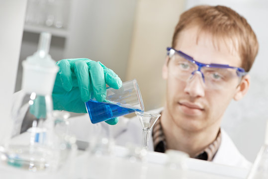 Man chemist scientist researcher in laboratory