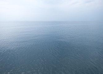 calm sea with gray sky