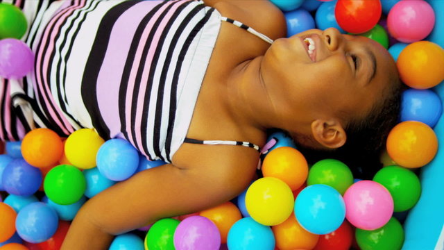 Little African American Girl in Ball Pool