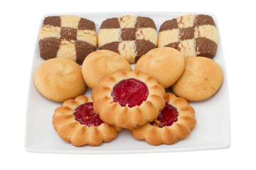 different cookies on white plate