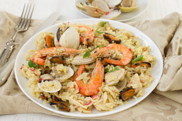rice with seafood on the white plate