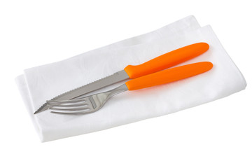 white napkin with fork and knife