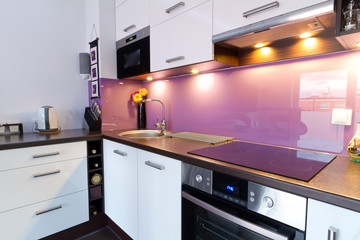 Modern white and purple kitchen interior