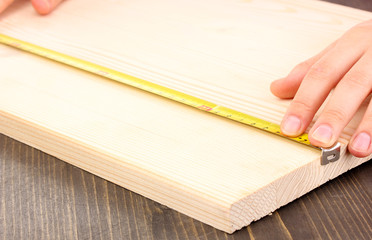 measuring wooden board close-up