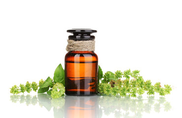 medicine bottle and flowers isolated on white