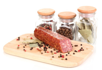 Tasty sausage on chopping board isolated on white