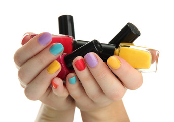 woman hands with nail polishes isolated on white