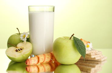 Glass of kefir, apples, crispbreads and measuring tape,